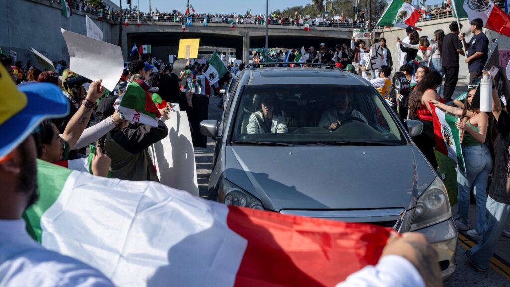 Demonstrators opposing Trump’s immigration crackdown block traffic in Los Angeles