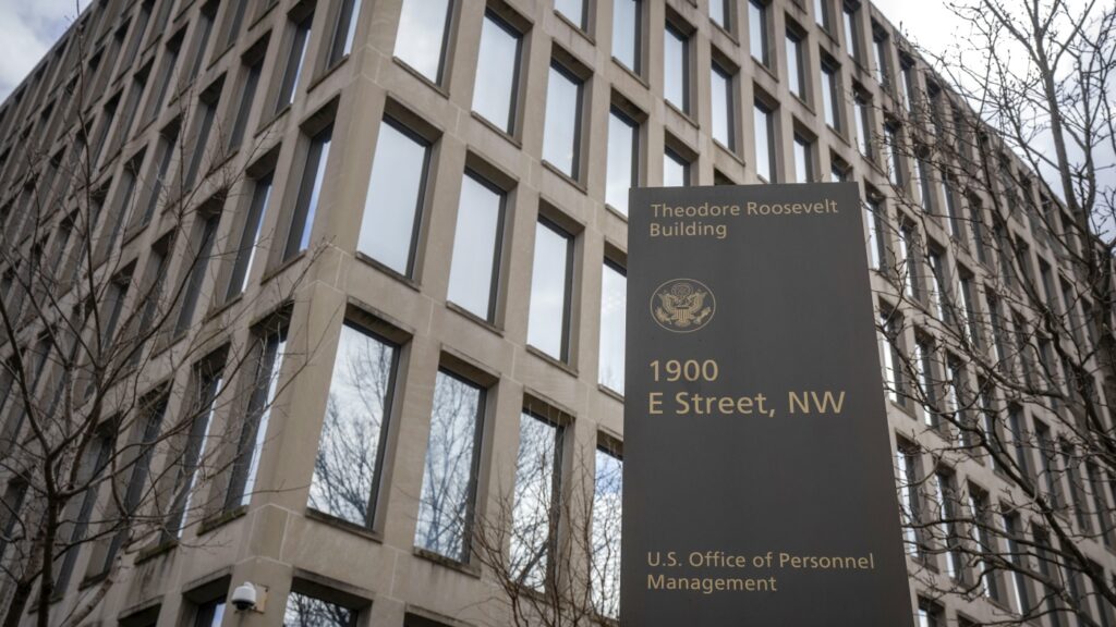 Trump’s spending cuts target probationary workers. What does the status mean?