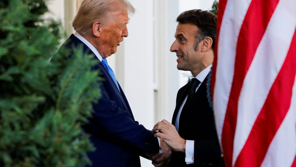 Watch Donald Trump’s unusually long handshake with French President Emmanuel Macron