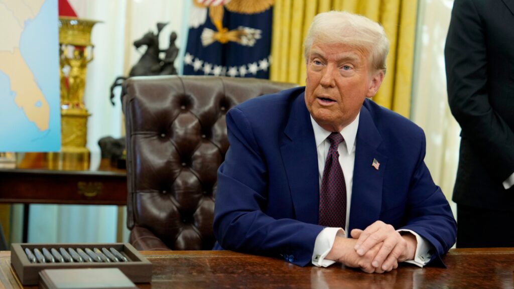 Trump signs order delaying some tariffs on Mexico and Canada for a month | AP News