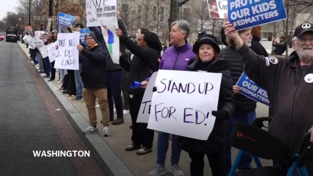 Protester to President Trump on education department cuts: “We will stand in your way.” | AP News