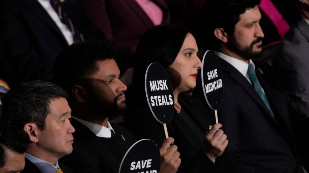 Democrats protest Trump’s address with signs: ‘This is not normal,’ ‘Save Medicaid’