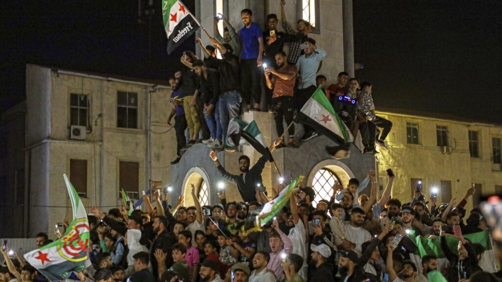 Syrians gather at Umayyad Square to celebrate after Trump announces easing of sanctions | AP News