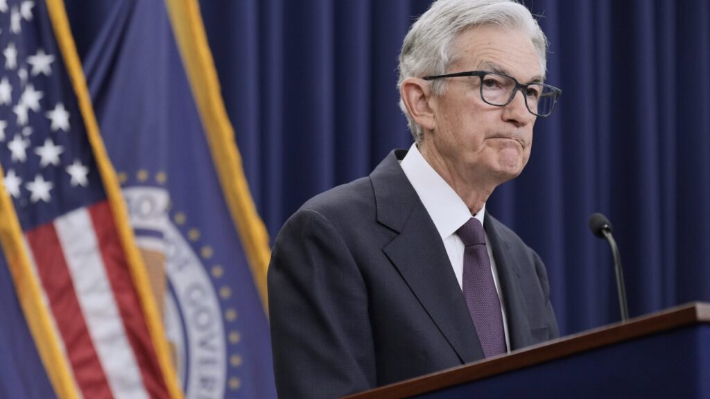 Fed leaves key rate unchanged as it awaits the impact of tariffs and Trump again scolds Powell
