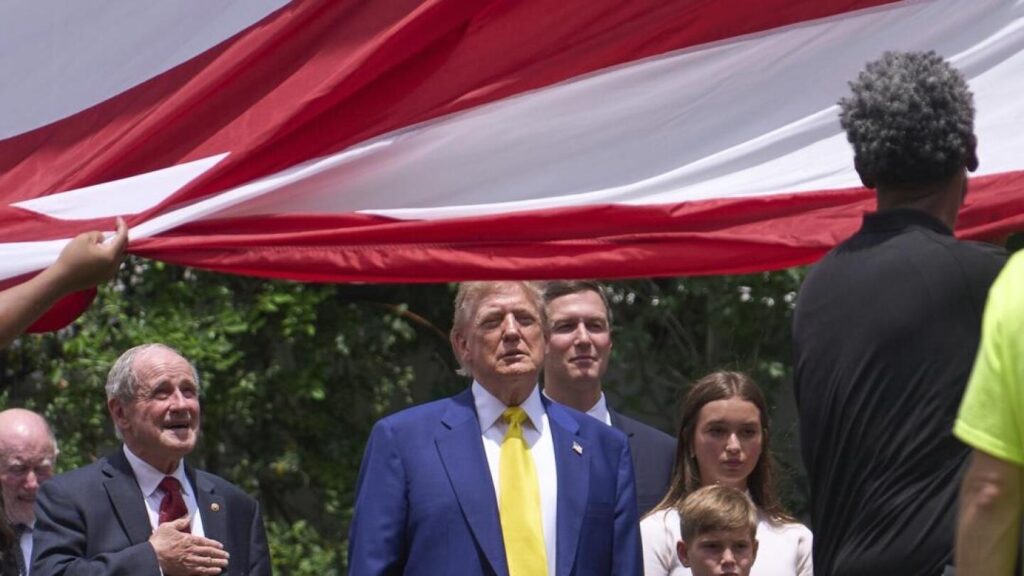 Trump watches US flag being raised on new pole at the White House | AP News